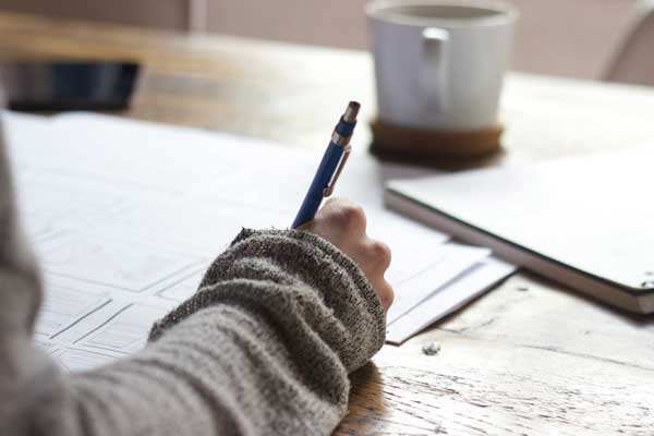 Person at writing desk
