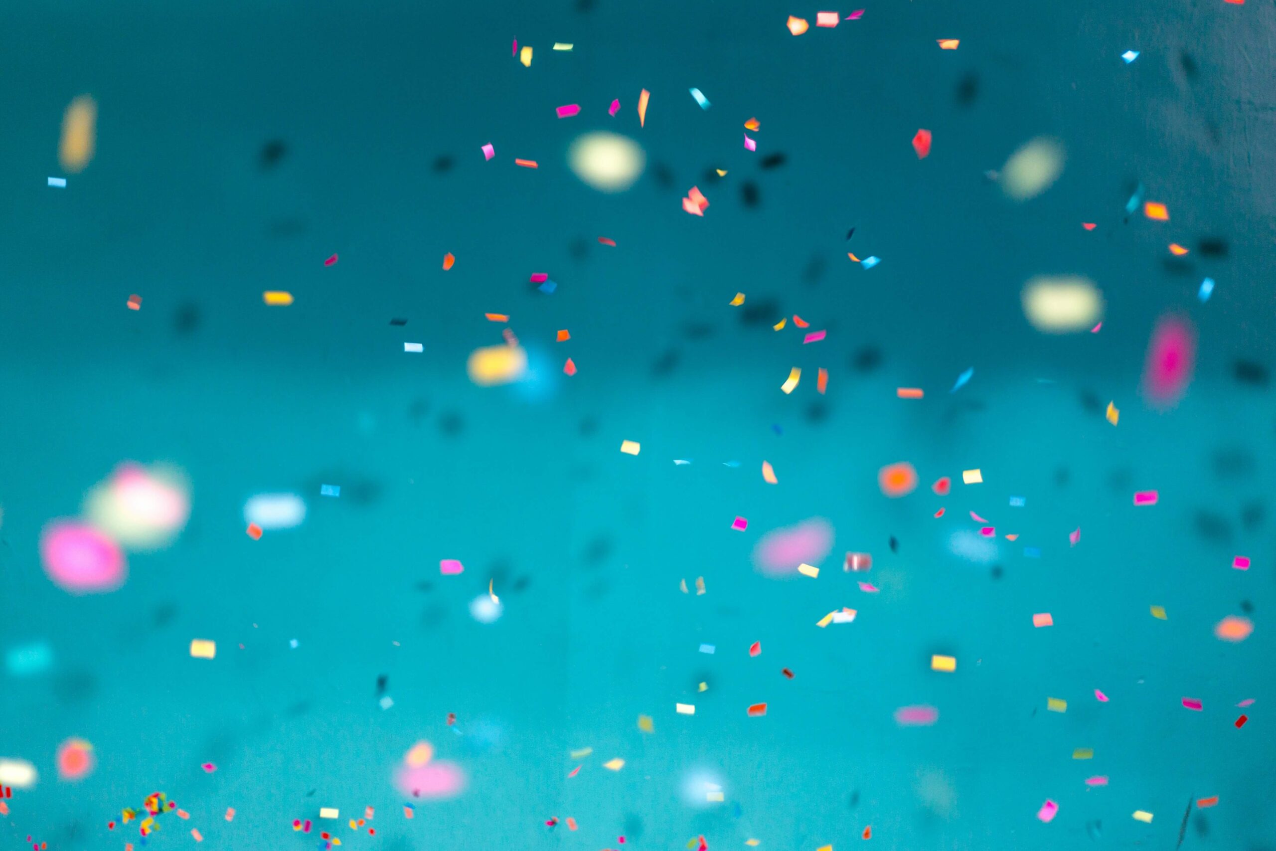 Confetti Confetti falling against blue background.