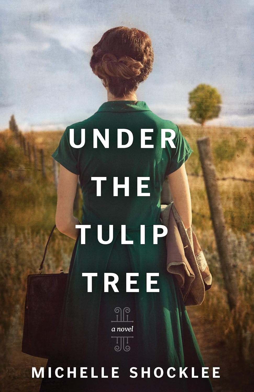 Book Cover feature woman walking in a field with back turned towards a tree.
