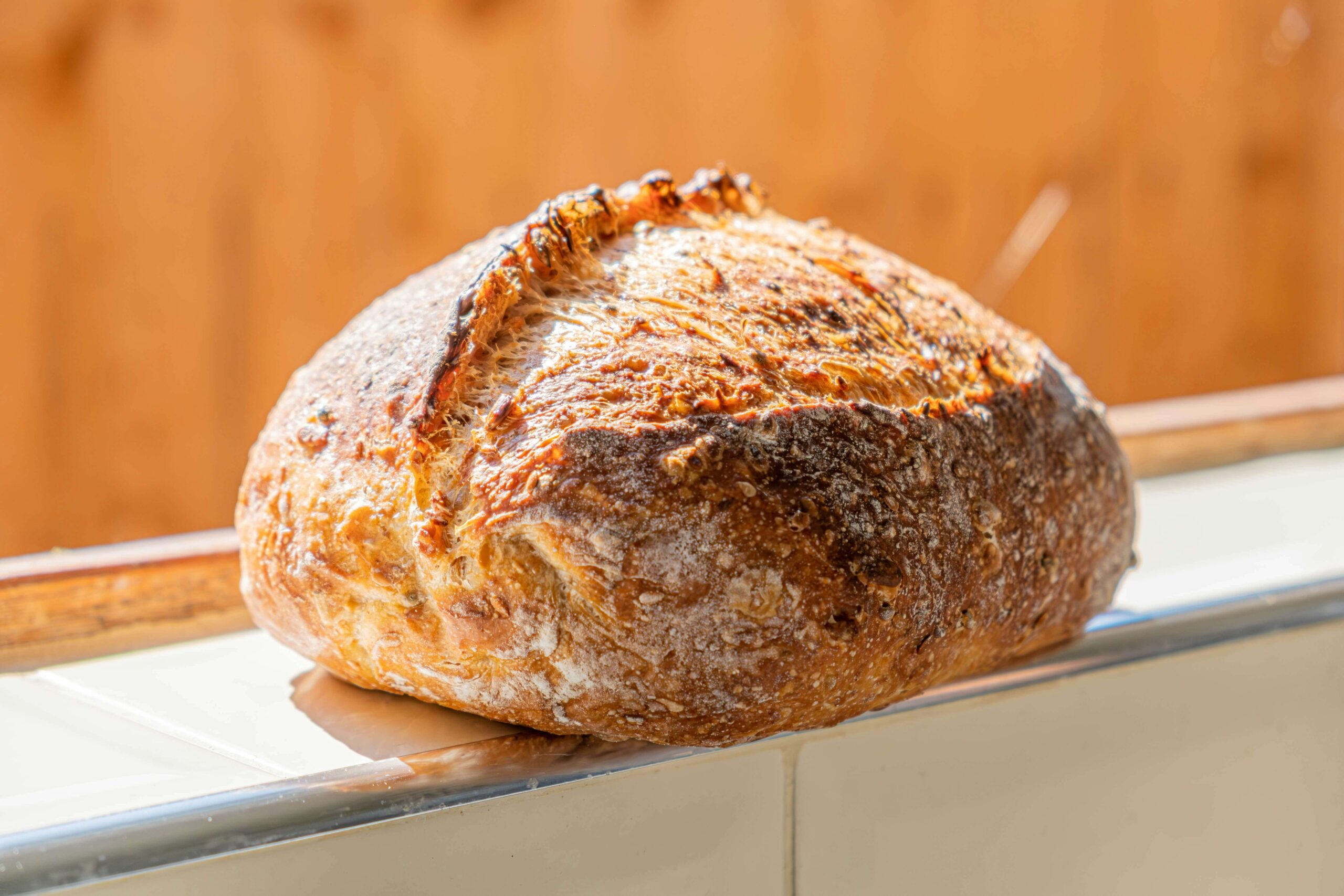 Sourdough Loaf of sourdough bread on window sill.